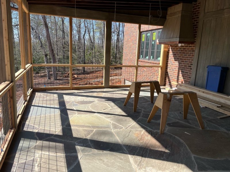 Screened in porch with bluestone floor