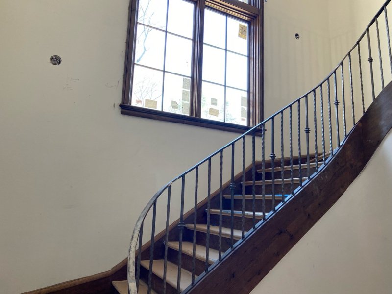 Custom built stairway with iron railing
