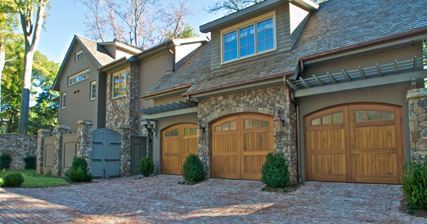 New Custom Luxury Home Greenville SC Amish-made custom carriage garage doors; hand-made brick pavers at drive
